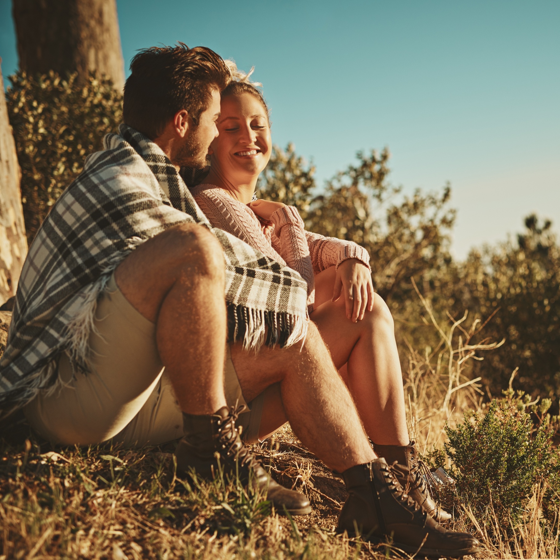 Happy hikers on a sunlit mountain trail